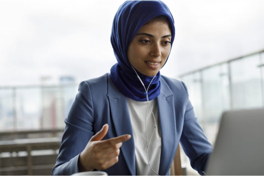 Lady watching a webinar on a laptop